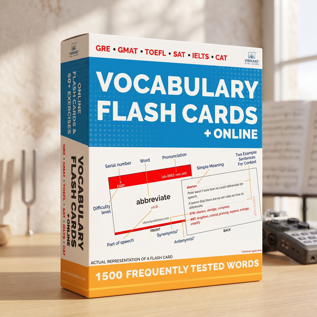 A boxed set of Vocabulary Flash Cards + Online study material standing on a wooden surface, with a blurred desk scene in the background. The package is predominantly blue, white, and orange, with printed text and a sample flash card design visible on the front.