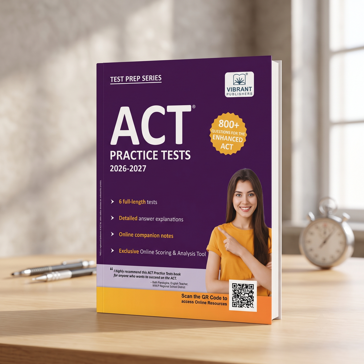 A purple and orange ACT Practice Tests book by Vibrant Publishers stands open on a wooden desk, with a blurred alarm clock and pen in the background.