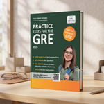 A paperback GRE practice test book titled 'Practice Tests for the GRE 2026' stands open on a wooden desk in a softly lit room. 