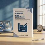 A book titled "Business Plan Essentials" by Dr. Annamaria Bliven stands upright on a wooden desk.